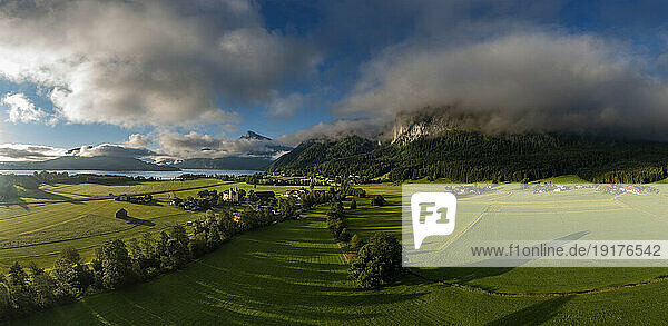 Austria  Upper Austria  Sankt Lorenz  Drone panorama of green fields at foggy sunrise