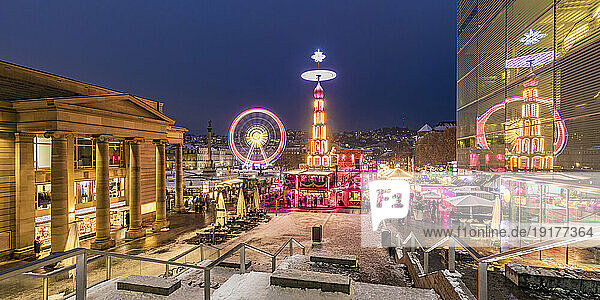 Germany,  Baden-Wurttemberg,  Stuttgart,  Schlossplatz at winter night with Ferris wheel and Christmas market in background