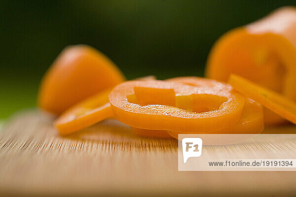 Sliced orange peppers on a chopping board