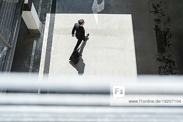 Top view of businessman with baggage on the go