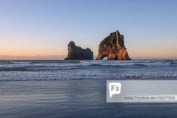 New Zealand  South Island New Zealand  Puponga  Wharariki Beach at dusk with Archway Islands in background