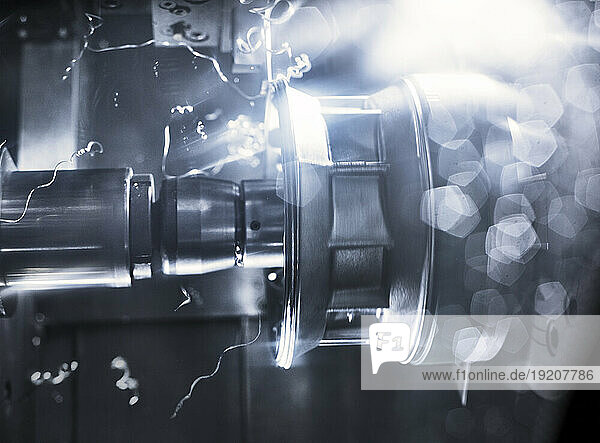 Macro shot of automated CNC Machine cutting metal