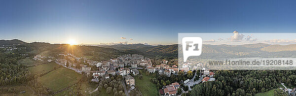 Italy  Tuscany  Torniella  Aerial panorama of mountain village at sunset