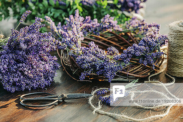 Lavender wreath and scissor on table