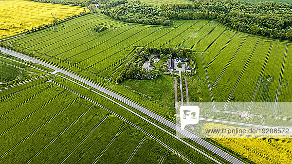 Denmark  Syddanmark  Christiansfeld  Aerial view of mansion surrounded by green fields in summer