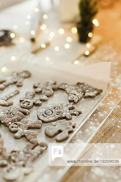 Gingerbread cookies on tray in kitchen