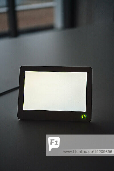 Tablet PC with blank screen at desk in office