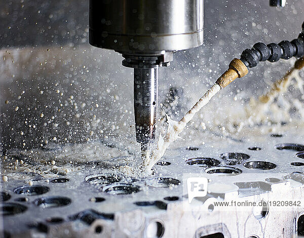 Close-up of CNC machine cutting metal in factory