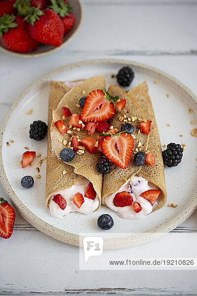 Buckwheat crepes with cream and berries
