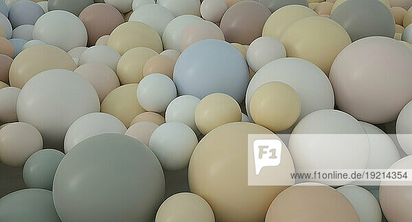Large group of pastel color spheres in studio