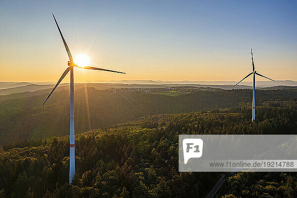 Germany  Baden-Wurttemberg  Aerial view of wind farm at sunrise