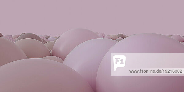 Pink spheres over colored background