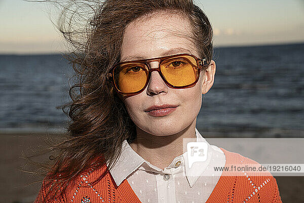 Young woman wearing sunglasses at beach