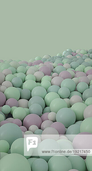 3D spheres against pastel green background