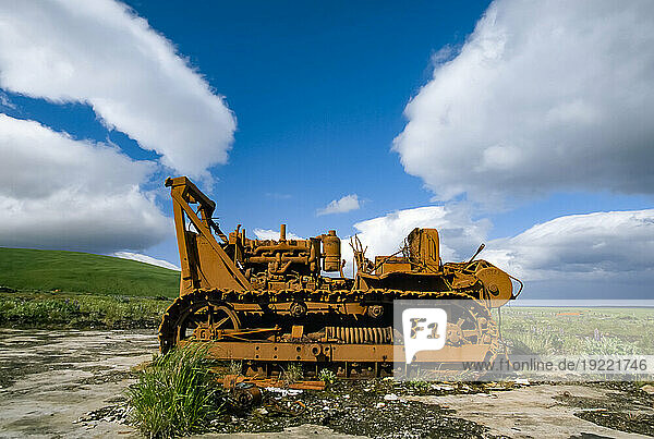 Large bulldozer near a field; Umnak Island  Aleutian Islands  Alaska  United States of America