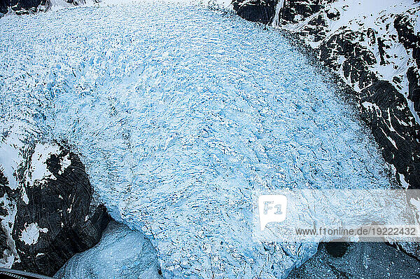 Le Conte Glacier spilling over a mountainside  Alaska  USA; Alaska  United States of America