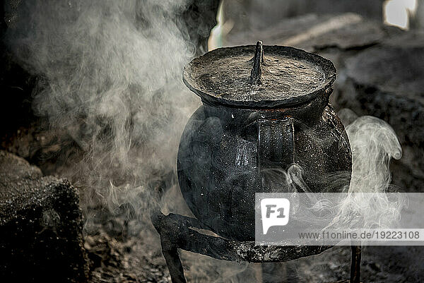 Cast iron cooking pot simmers; Ejido Hidalgo  San Luis  Mexico