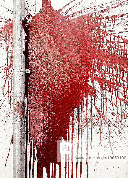 Red Paint splashed on a Wall