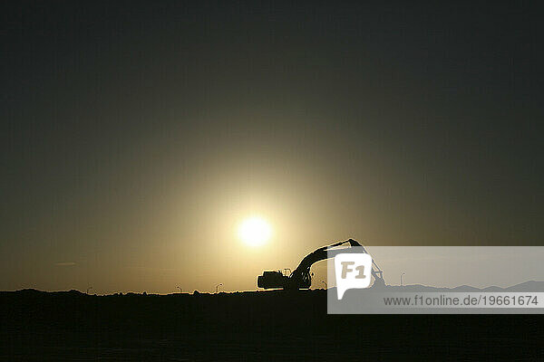 A tractor sits vacated as the sun sets in northern California  2006.