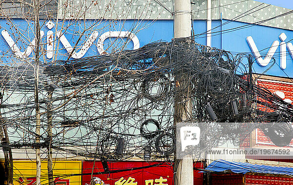 Convoluted electric and telephone wires  X'ian  Shaanxi Province  China
