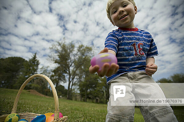 A young boy showing off one of his many Easter eggs  Newcastle  California.