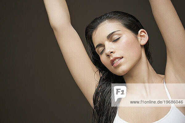 Woman with her arms stretched above her head