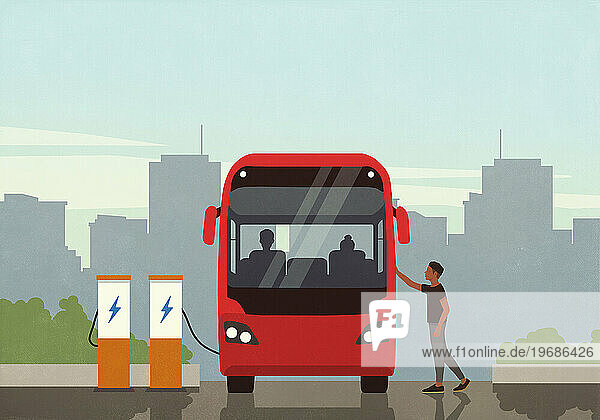 Man boarding electric bus at charging station in city