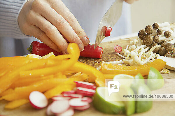Woman Chopping Vegetables with Knife  Close-up view