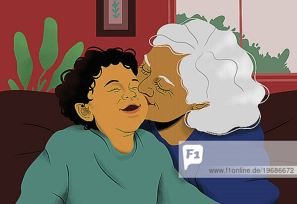 Happy grandmother kissing grandson on sofa