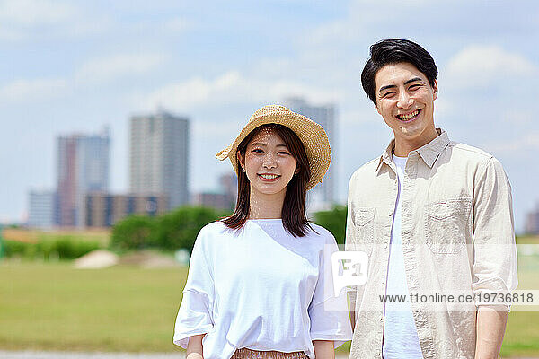 Young Japanese couple at city park