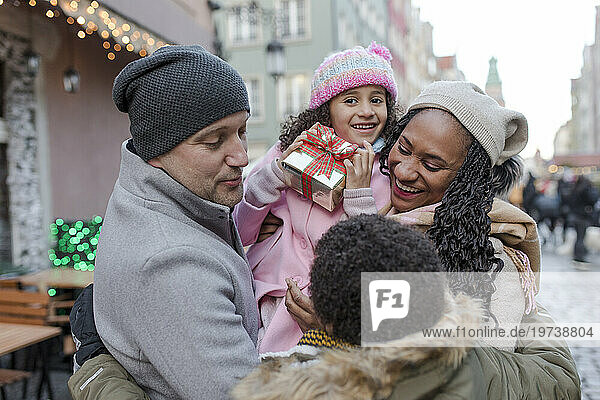 Happy family together enjoying at Christmas market