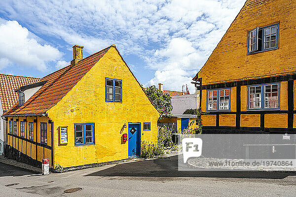 Denmark  Bornholm  Gudhjem  Empty street along yellow town houses