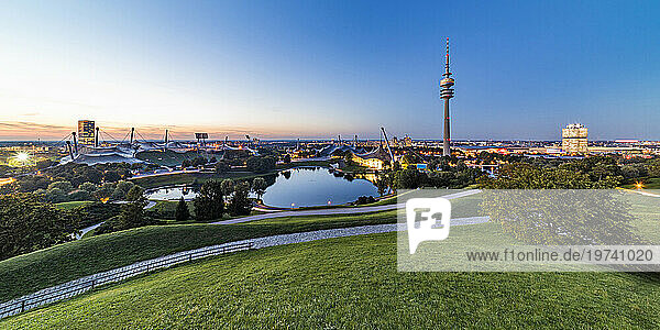 Germany  Bavaria  Munich  Panoramic view of Olympic Park with Olympic Tower  BMW Building and pond in background