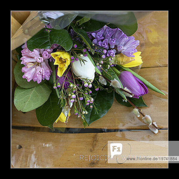 Colorful  spring bouquet to encourage on a wooden Adirondack chair background; Studio Shot