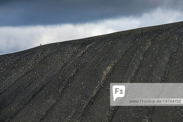 Two hikers on the top of a crater in Hverfjall  Iceland; Iceland