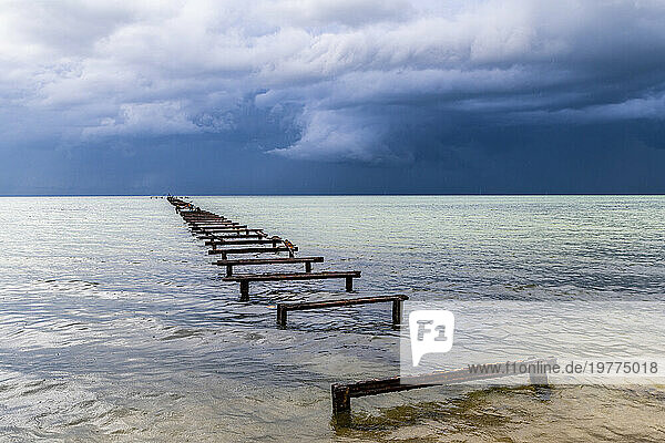 Destroyed pier at a Luxury hotel in Hotel el Colony before a storm, Isla de la Juventud (Isle of Youth), Cuba, West Indies, Central America