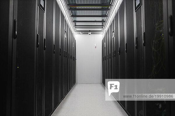 Aisle between rack cabinets in server room