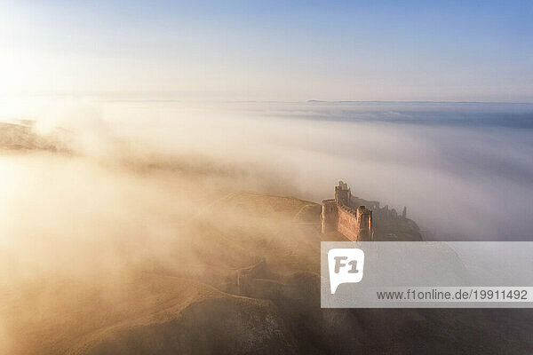 UK  Scotland  North Berwick  Aerial view of Tantallon Castle shrouded in morning fog