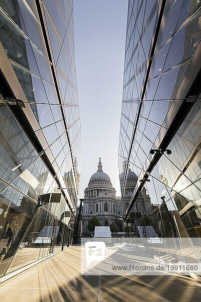 St Paul's Cathedral near glass buildings on sunny day in London city