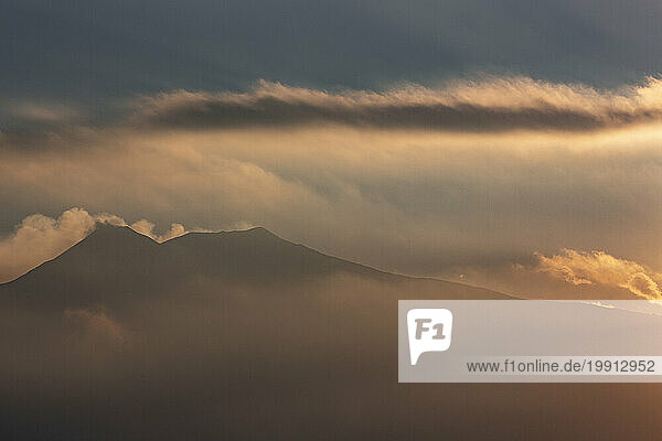 Italy  Sicily  Clouds over Mount Etna at dusk