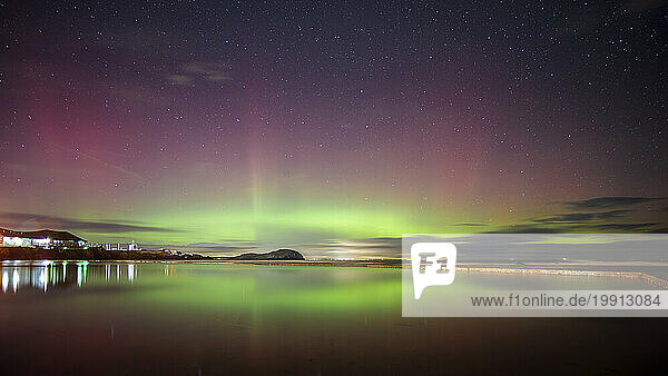 UK  Scotland  North Berwick  Long exposure of Aurora Borealis over Firth of Forth at night