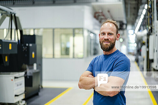 Portrait of a confident employee in a factory