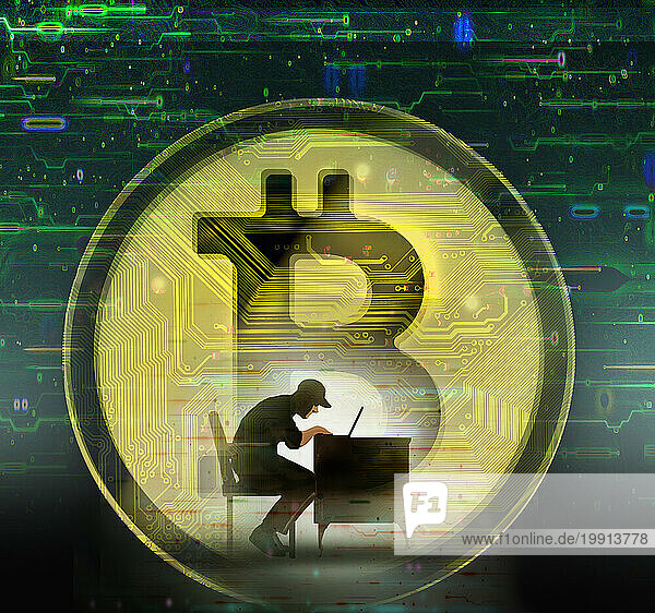 Hacker using laptop against oversized bitcoin