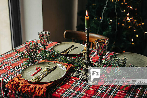 Plates and wineglasses on Christmas table