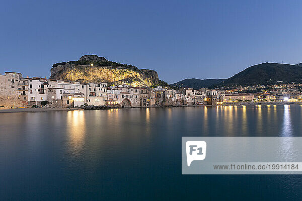 Italy  Sicily  Cefalu  Long exposure of coastal town at dusk