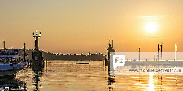 Germany  Baden-Wurttemberg  Konstanz  Panoramic view of harbor on shore of Bodensee at sunrise