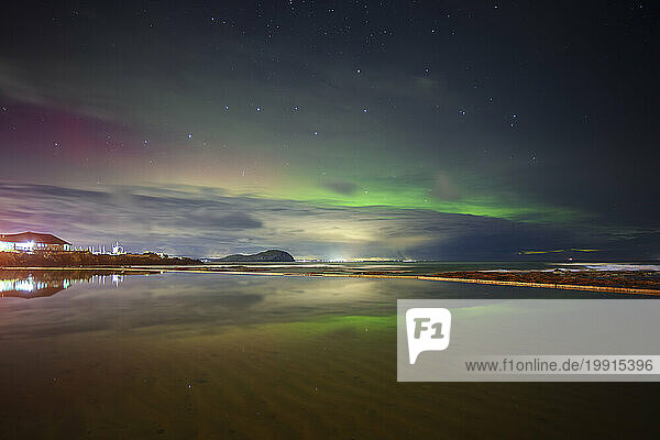 UK  Scotland  North Berwick  Long exposure of Aurora Borealis over Firth of Forth at night