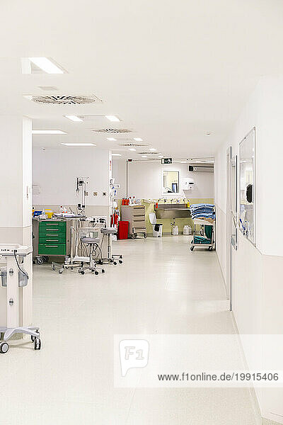 Empty hospital with equipment near white colored wall