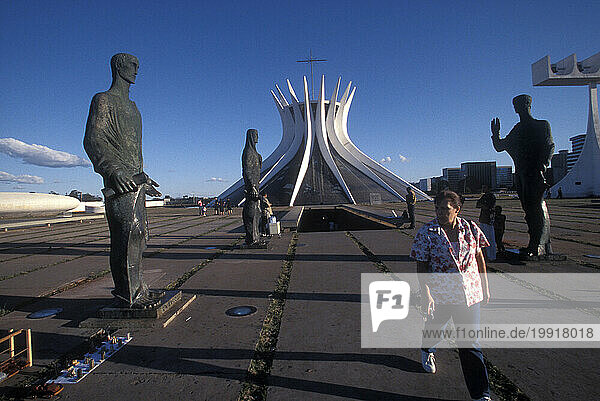 Statues in front of the modern Metropolitan Cathedral in Brasilia  the futuristc capital of Brazil.