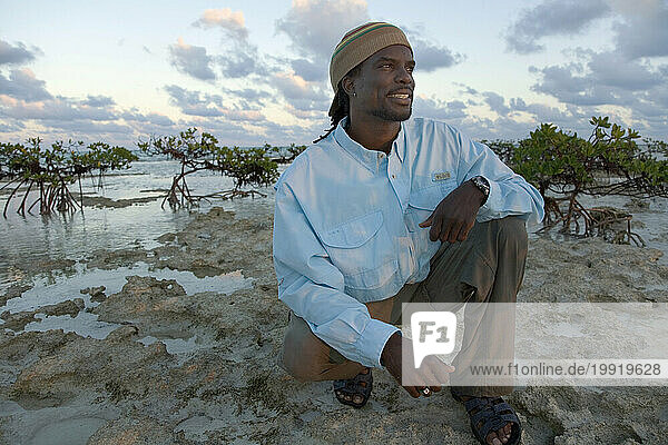 Bonefishing guide poses for a photo near the Andros Island Bonefish Club